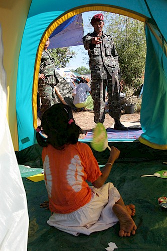 Tsunami aftermath Thai soldiers and child